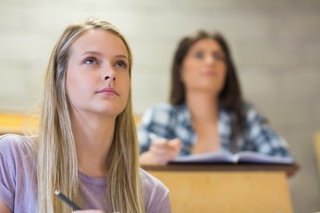 Students sitting beside each other while learning