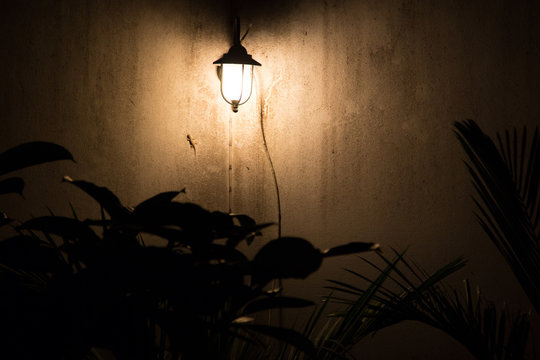 Street lantern on a wall at dark night

