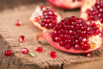 pomegranates on a wooden background