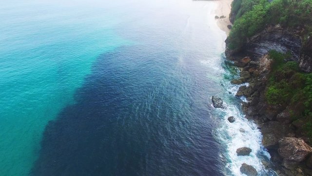 Etretat Aval cliff, rocks and natural arch landmark and blue ocean. Aerial view. Indonesia, Bali.