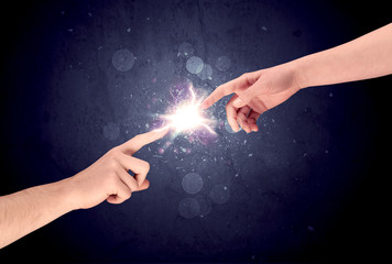 Hands reaching to light a spark