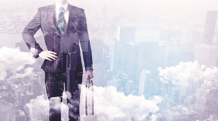 Business man standing at city view background
