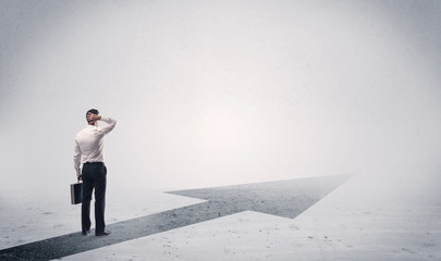 Standing salesman looking ahead with arrow