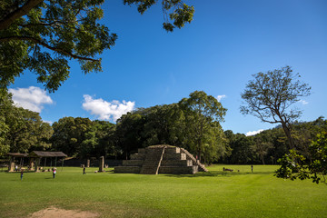 Blue sky day in an ancient pyramid at pre-columbian city of Copan, Honduras