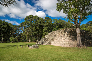 Blue sky day in an ancient pyramid at pre-columbian city of Copan, Honduras