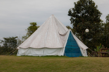 Tourist tent in camp among meadow in the mountain