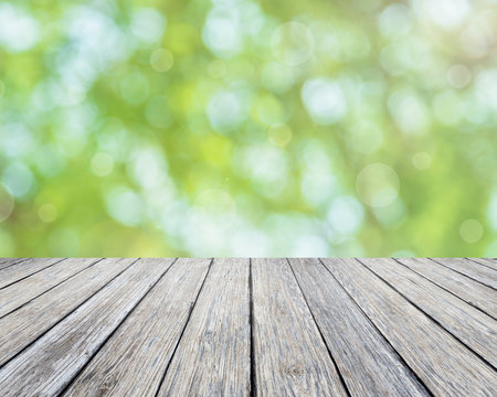 Wooden plank and bright spring bokeh background - can be used for display your products