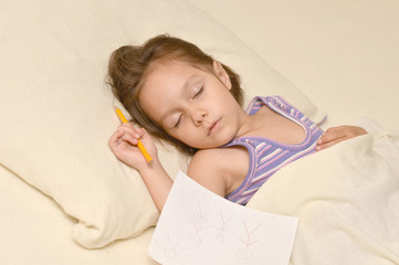 Little girl sleeping with picture