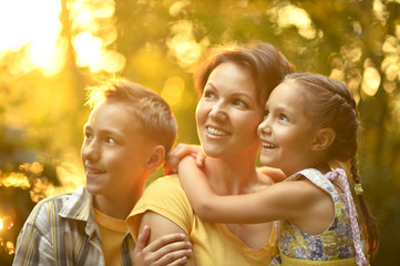 Fototapeta premium Mother with kids on the field