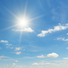 Obraz na płótnie Canvas sun on beautiful blue sky