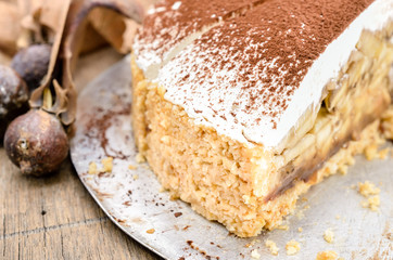 Banoffee pie on wooden table in soft light, Selective focus and close up 