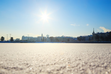 Fototapeta premium View of quay wharf embankment Yekaterinburg City. Winter. Sun