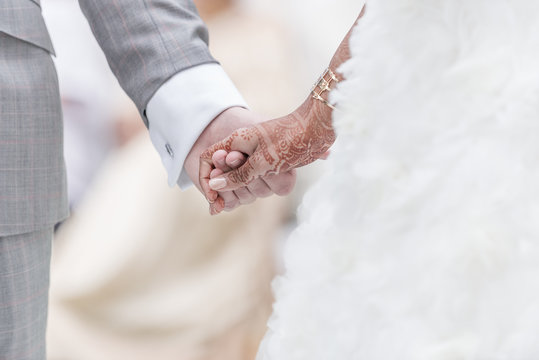 Close-up Holding Hands In Indian Wedding Ritual.