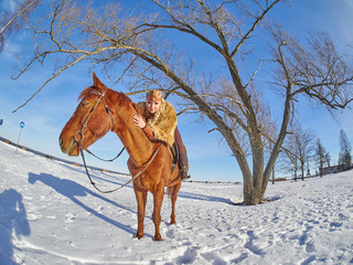 Fototapeta na wymiar Medieval girl on a horse in the winter