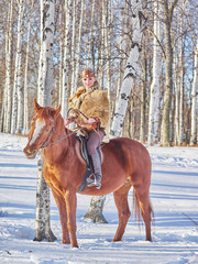 Fototapeta na wymiar Medieval girl on a horse in the winter