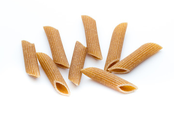 Rye flour macaroni pasta close up isolated on white.