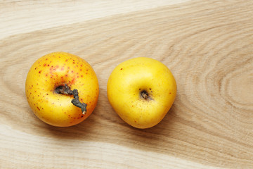 Naklejka na ściany i meble two apples on old wood table