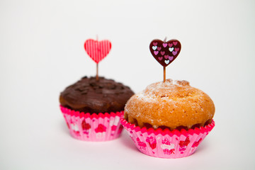 Testy muffins on white background for Valentine's day. Selective