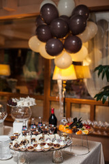 nicely decorated festive wedding sweet buffet table