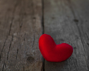 Fototapeta premium Valentines day red heart on old wooden background