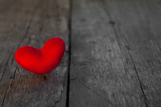 Valentines day red heart on old wooden background
