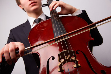 Fototapeta premium young man with a cello