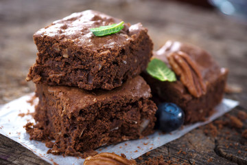 Brownies on wooden background