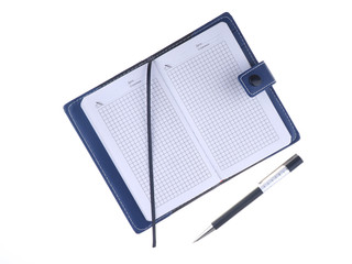 notebook with a pen on a white background