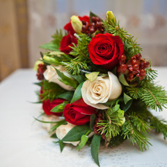 Fototapeta na wymiar winter bridal bouquet of flowers and fir branches