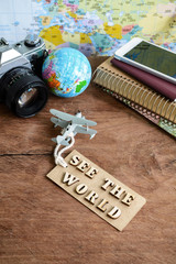Outfit of traveler on wooden background and copy space, Vintage