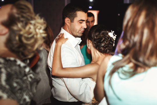 Romantic married couple bride and groom dancing at wedding recep