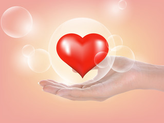 Woman Hand and heart ; bubbles on background