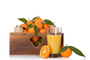 Fresh ripe mandarines in wooden crate.