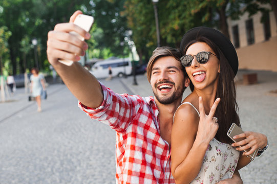 Fashion couple making selfie photo in the city