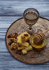 Cheese, nuts, honey and white wine