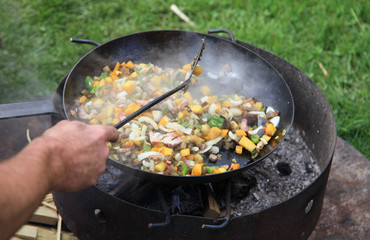 Grill with pan full of vegetables