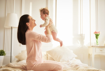 mother playing with her baby