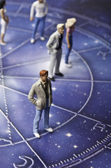 Fototapeta na wymiar astrology chart with people figurines