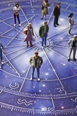 astrology chart with people figurines