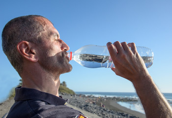 Thirst: man drinking water from bottle :)