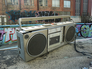 Old 80's boom box stereo by an abandoned pool - landscape photo