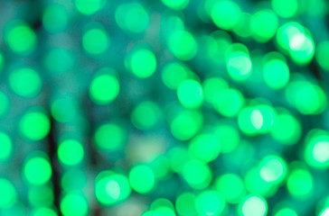 abstract blur blackground with bokeh defocused lights in  green color