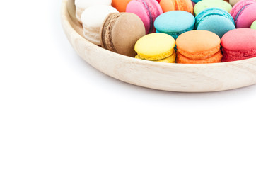 macarons colorfull in wooden bowls on white background