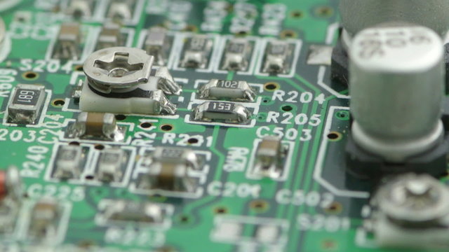 macro video of scrap integrated circuit boards and old electronic chips rotating smoothly