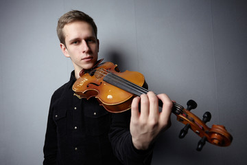 man playing violin close-up