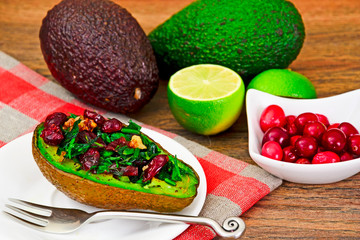 Avocado salad with herbs dill, parsley, cilantro, nuts