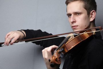 man playing violin close-up