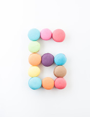 Fototapeta na wymiar colorful macarons arrangment is number six