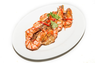 shrimps done with garlic, onion, and olive oil in the grill