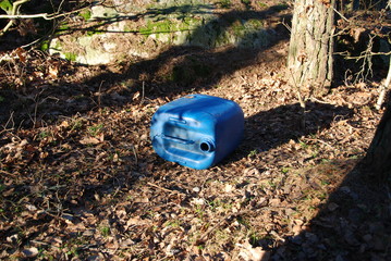 Littering nature and pollution of the environment with a plastic can